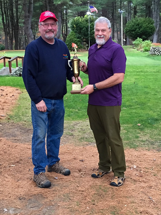 Mark presents Mike with trophy