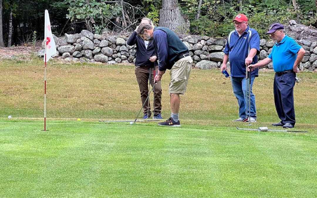 Chamber of Commerce Team chipping onto green