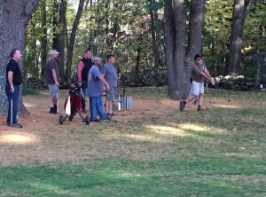 group watches tee of during skins game