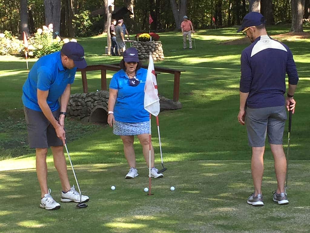 Team Kennebunk Savings Bank with a Tough Putt