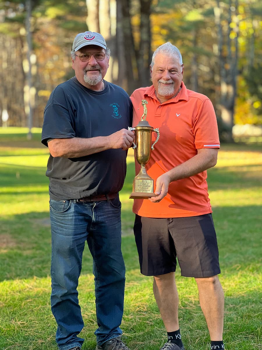 Mark hands 4-peat winner, Mike Ramini, the trophy