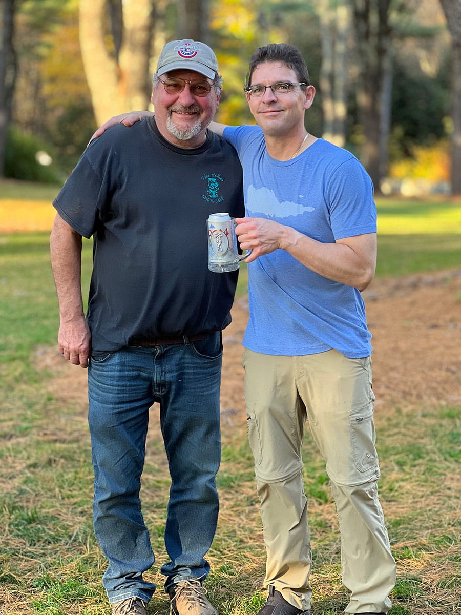 Sean Dumont accepts the coveted Coors Beer Mug 2nd place award from Mark L'Hereuex