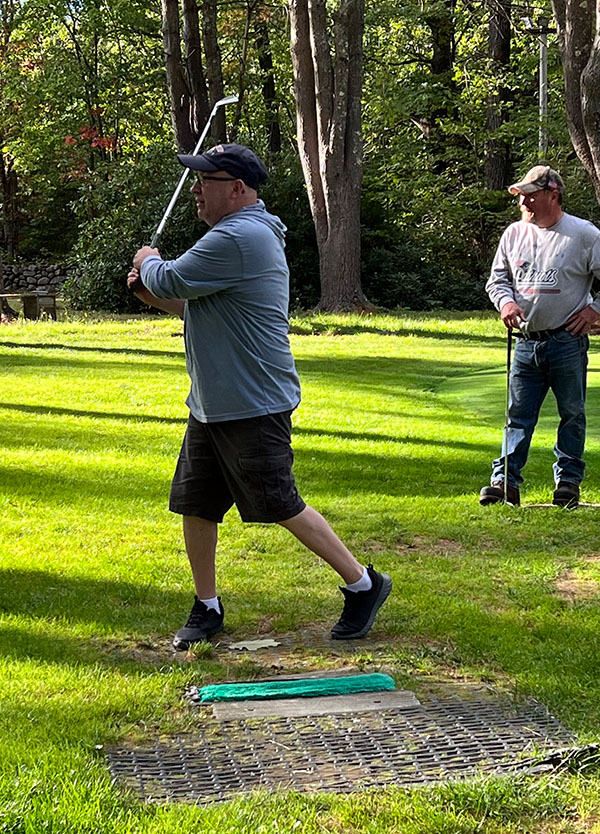 Mitch tees off