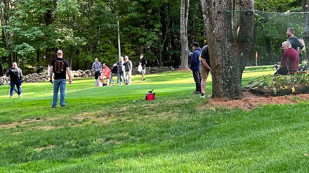 Shaw's Warehouse employees playing golf