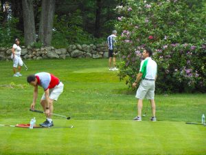 golf tournament teams in action